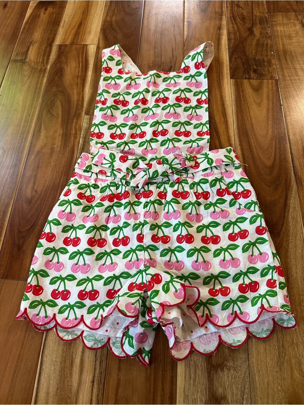 NWT Mini Boden x Molly Mahon Cherry Tie-Waist Scallop Romper. Size 5-6 years